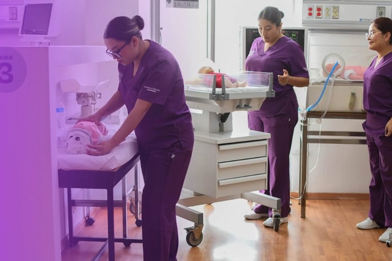 Medical professionals in purple scrubs demonstrating neonatal care with an infant in a hospital incubator room