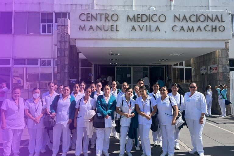 Healthcare workers in white and blue uniforms standing outside Centro Medico Nacional Manuel Avila Camacho building with purple overlay effect